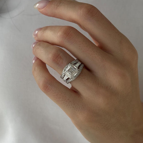 Asscher moissanite three stone bridal set with curved pave bands in white gold worn on the hand