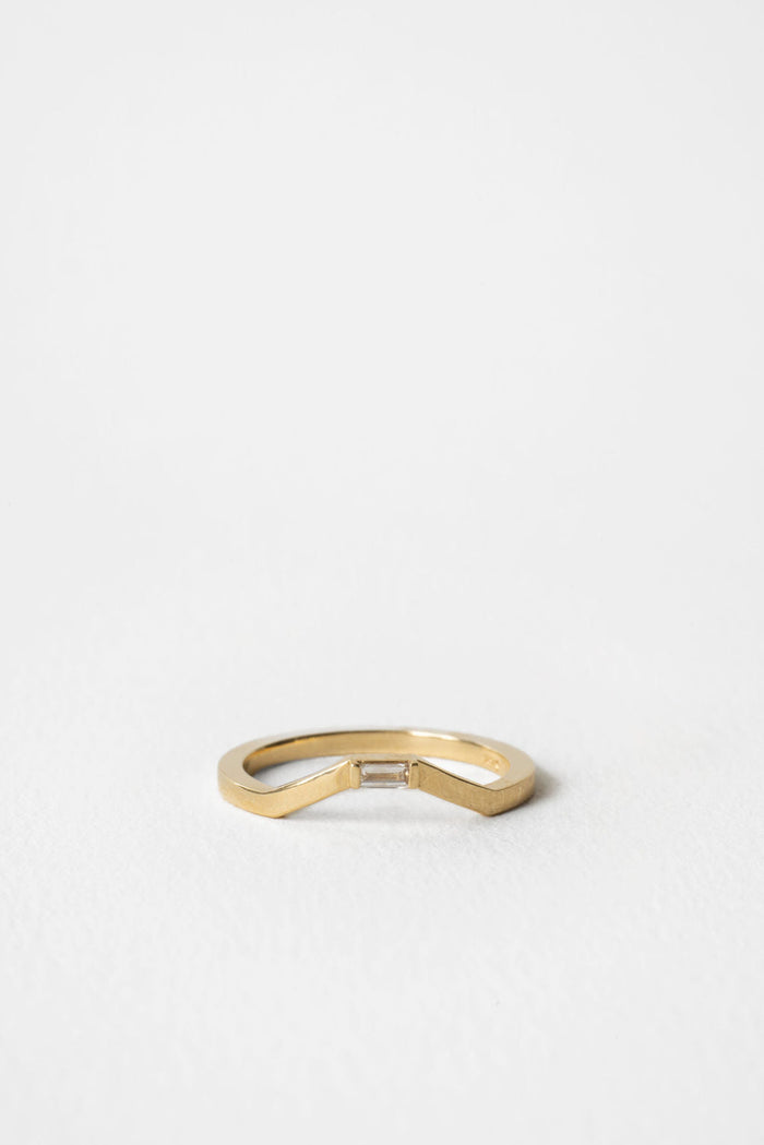 Baguette moissanite curved wedding band 0.05 CT TW in yellow gold, front view