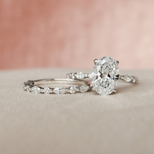 Oval cut lab grown diamond bridal ring set with marquise station bands in white gold