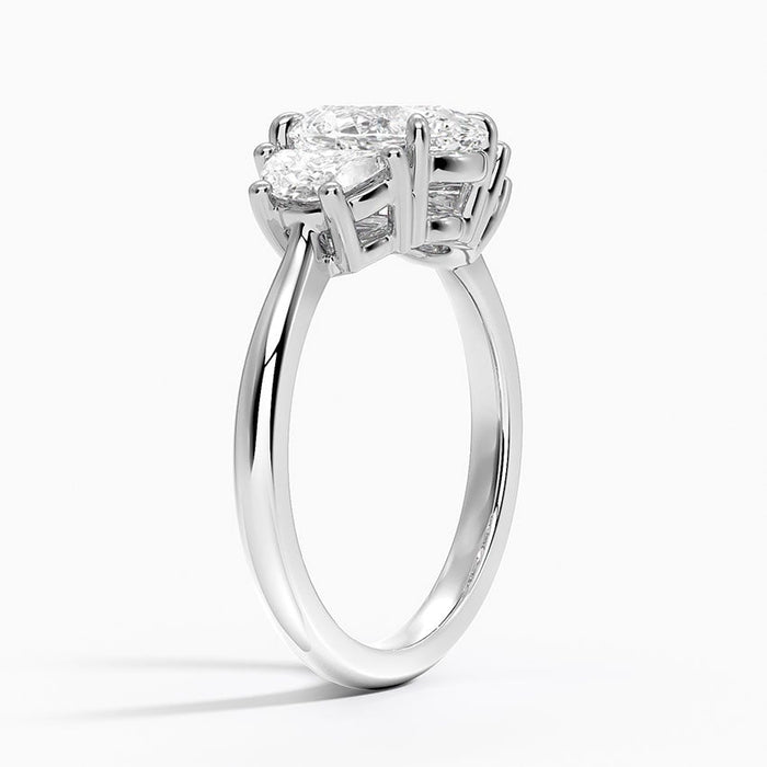 Profile view showing the half moon straight edges against the centre stone and the plain tapered band