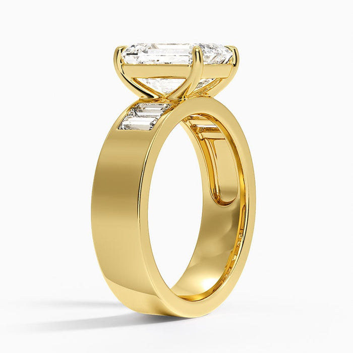 Side profile showing the wide flat band and low set emerald cut diamond
