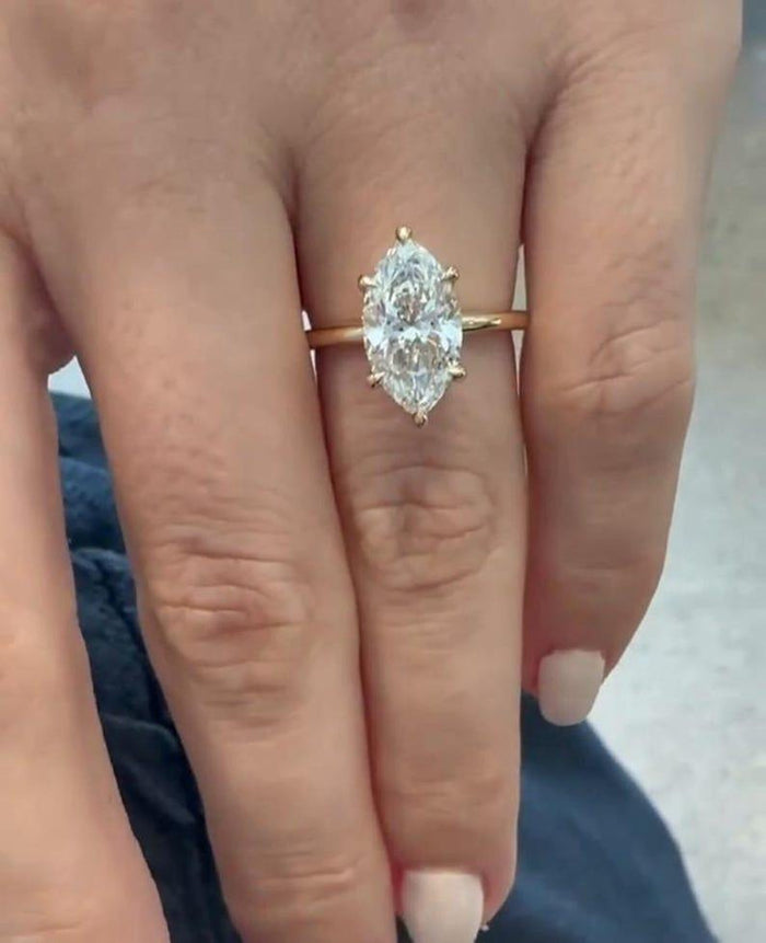Six prong marquise cut lab grown diamond ring angled view
