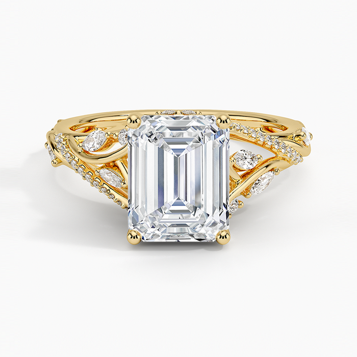 Emerald cut lab grown diamond ring in yellow gold with open branch vine band and marquise leaf diamonds, top view