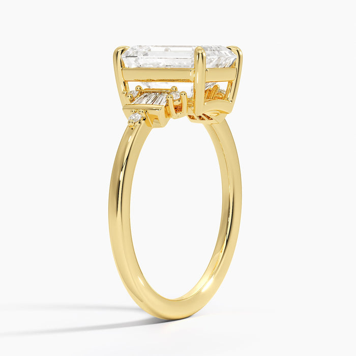 Profile view showing the bar set baguettes beside the emerald cut stone