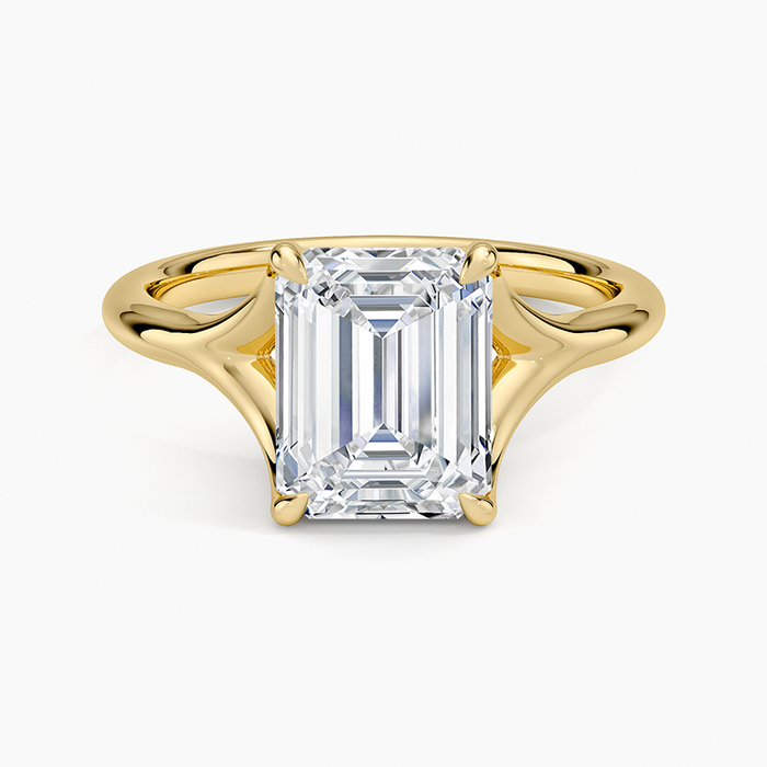 Emerald cut lab grown diamond solitaire ring in yellow gold with flared split shank, top view