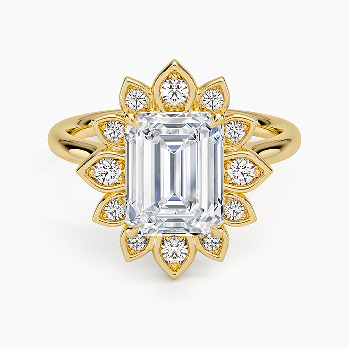 Emerald cut lab grown diamond ring in yellow gold with floral petal halo and milgrain bezels, top view
