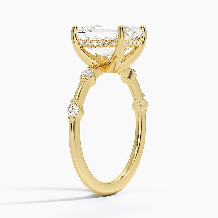 Profile view showing each accent diamond in its own prong collet on the fine band