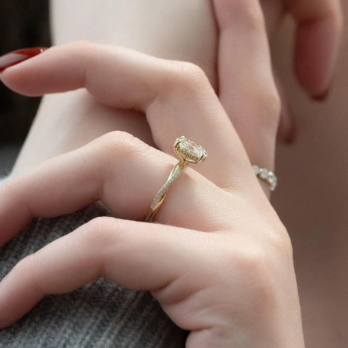 Oval cut lab grown diamond pave engagement ring, angled view