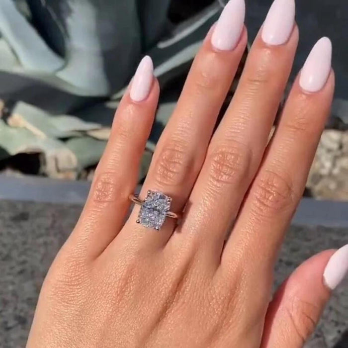 Elongated cushion cut lab grown diamond engagement ring with hidden halo