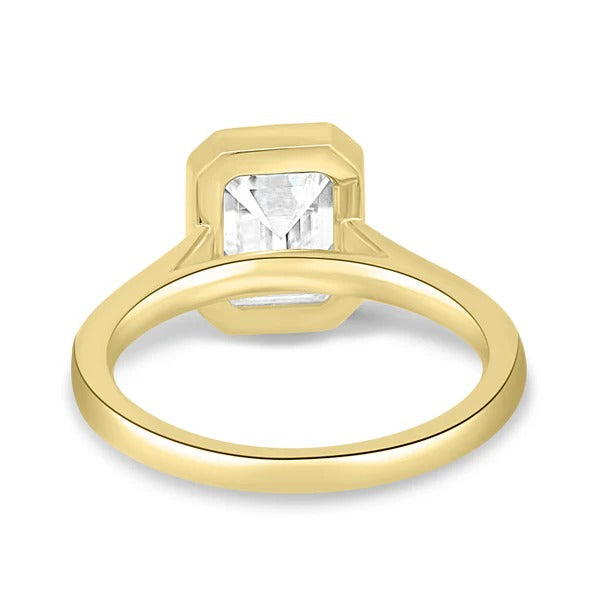 Bezel emerald solitaire ring side view