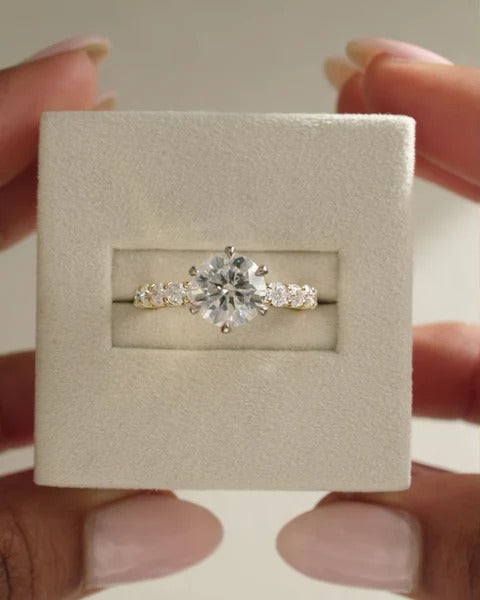 Six claw round cut diamond solitaire engagement ring