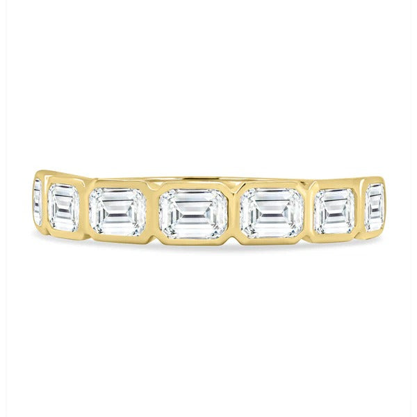 East west emerald bezel wedding band side view