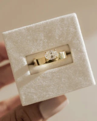 East west oval cigar band ring side view