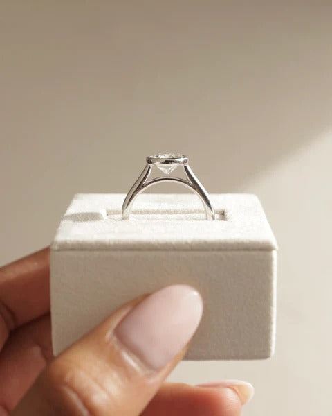 Bezel set round cut diamond solitaire engagement ring