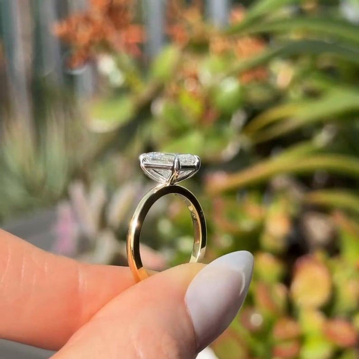 Emerald cut lab grown diamond plain band ring angled view