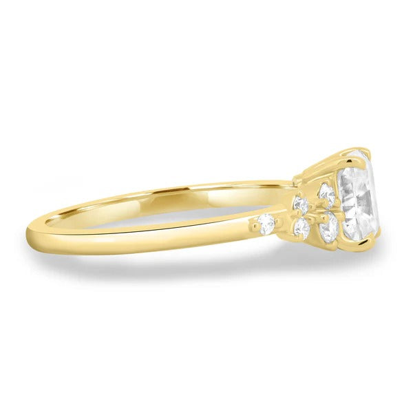 Elongated cushion cut diamond ring with accent stones