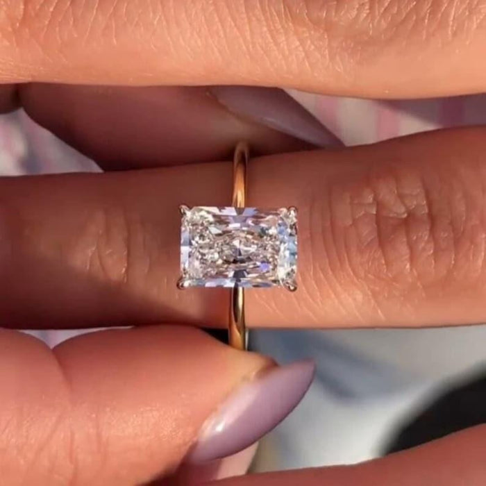 Yellow gold radiant cut lab grown diamond ring angled view