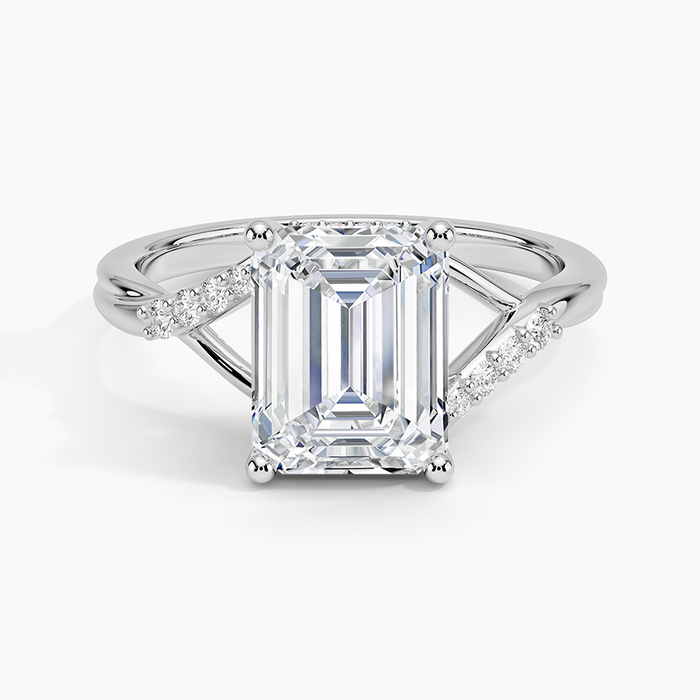 Emerald cut lab grown diamond ring in white gold with split shank and angled accent row, top view