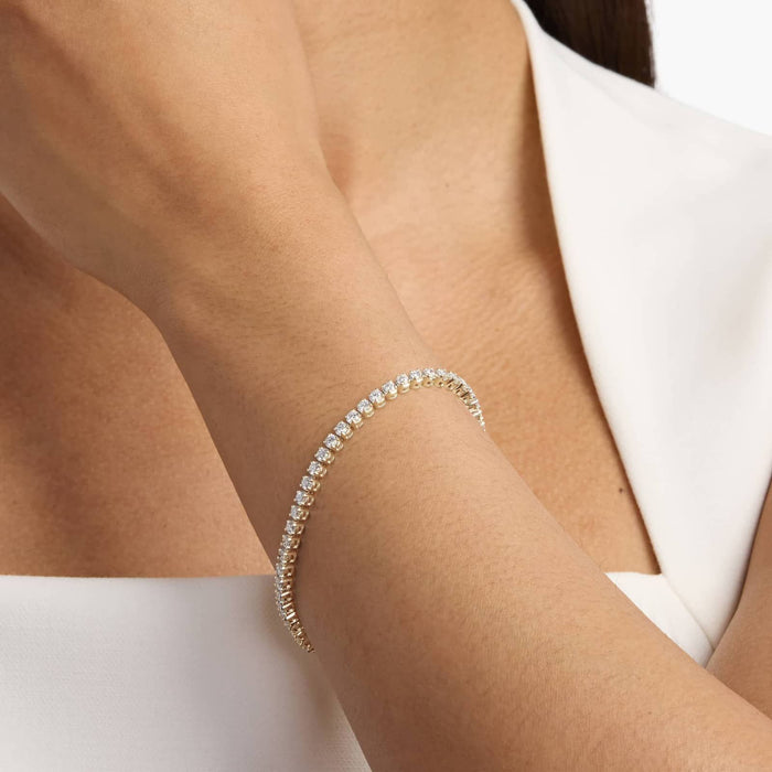 Round moissanite tennis bracelet with four prong settings shown close up