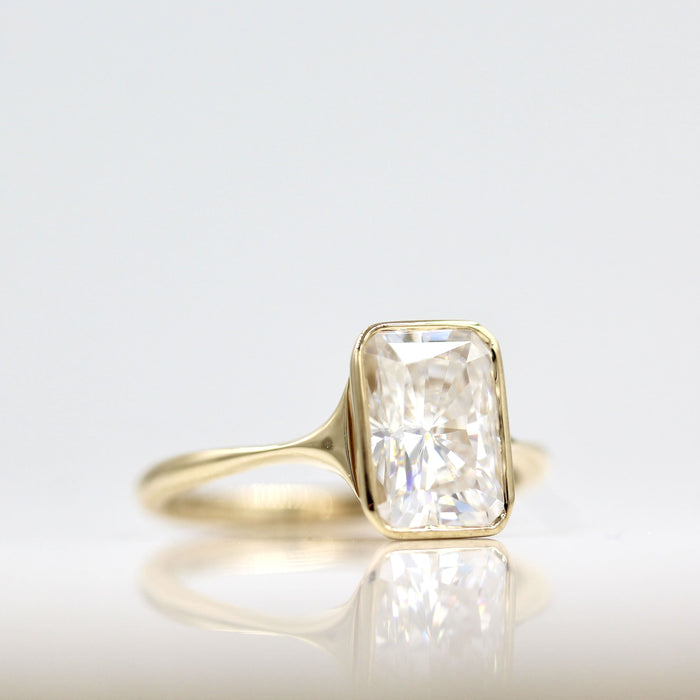 Radiant cut lab grown diamond bezel solitaire engagement ring