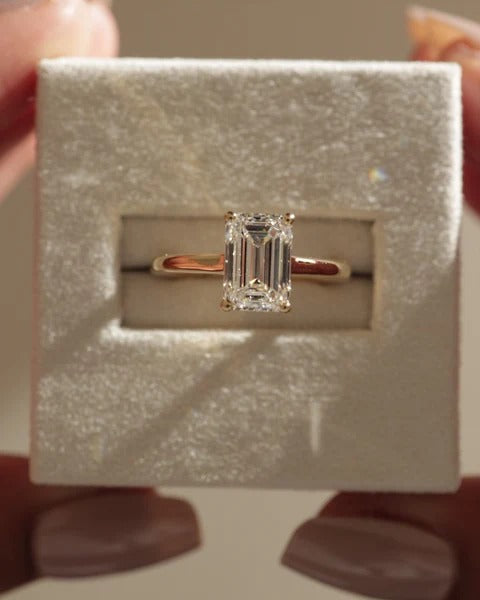 Emerald cut diamond solitaire cathedral engagement ring