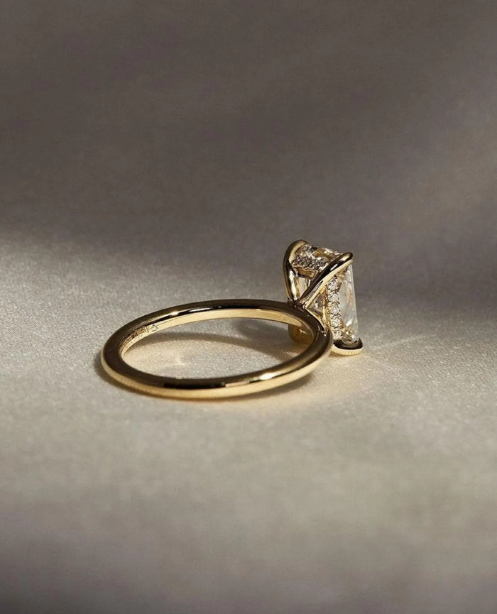 Profile showing the hidden halo beneath the radiant cut centre stone