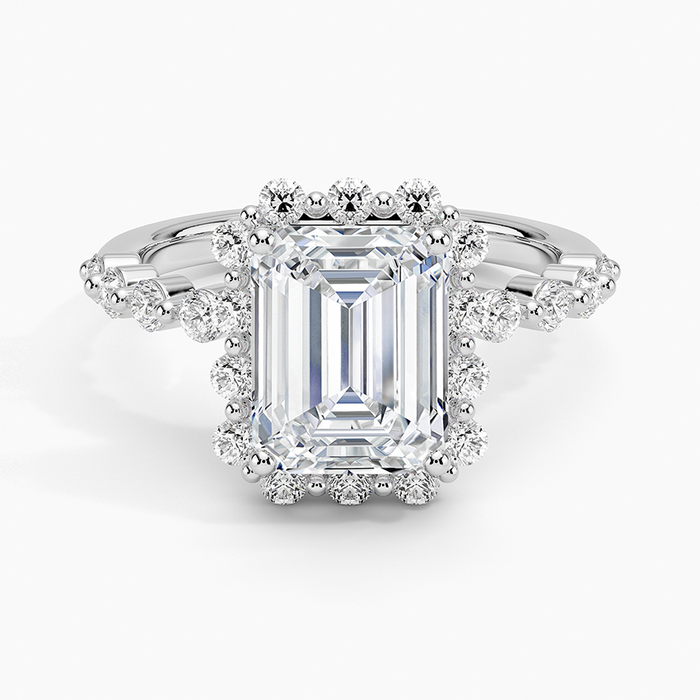 Emerald cut lab grown diamond ring with floating round diamond halo in white gold, top view