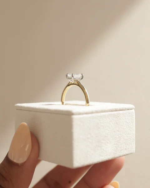 Emerald cut diamond solitaire hidden halo cathedral engagement ring