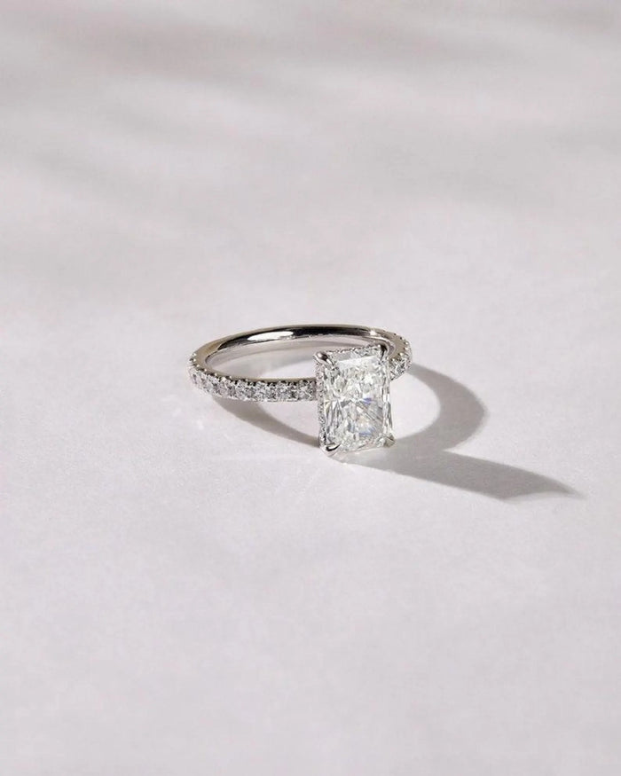 Radiant cut lab grown diamond engagement ring with pave band in white gold