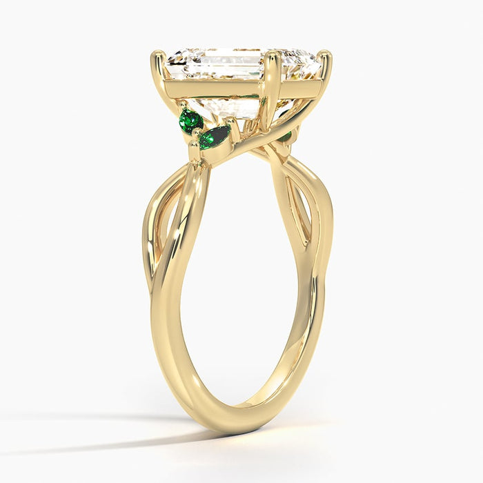 Profile view showing the twisted two strand vine band and emerald leaf accents