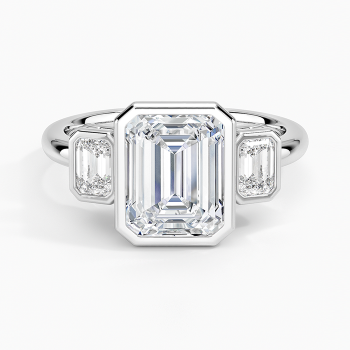 Emerald cut lab grown diamond ring in white gold with bezel set emerald cut side stones, top view
