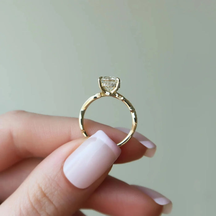 Round brilliant lab grown diamond with marquise leaf accent shoulders, front view