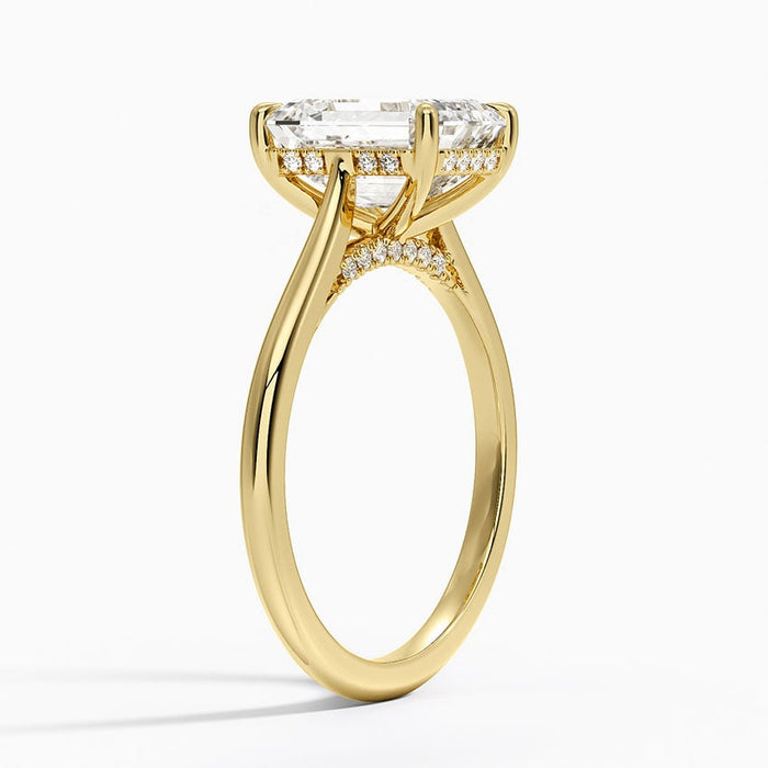 Profile view showing the milgrain edged hidden halo and the pave arc set into the gallery
