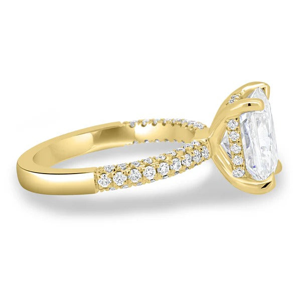 Radiant cut diamond solitaire ring with hidden halo and triple pave band