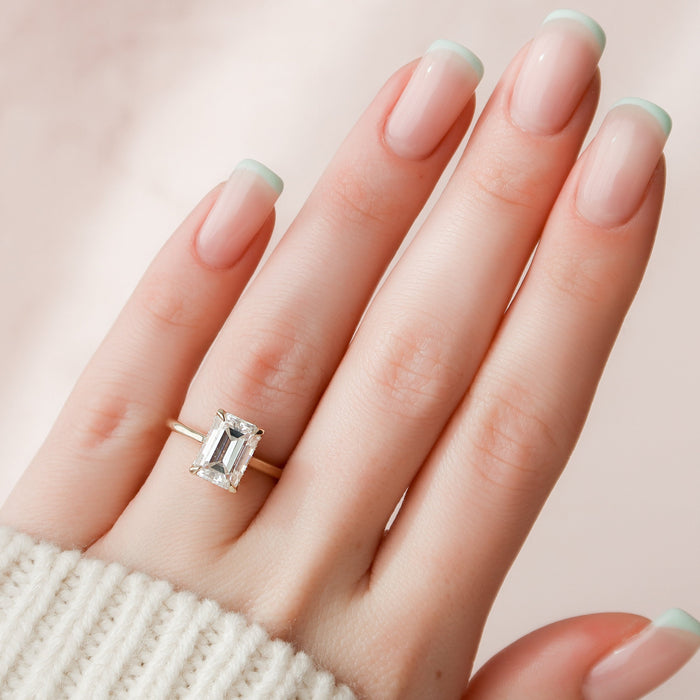 Emerald cut moissanite hidden halo ring, front view