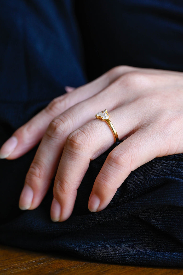 Five stone marquise cut moissanite ring with graduated stones on a slim yellow gold band, view 2