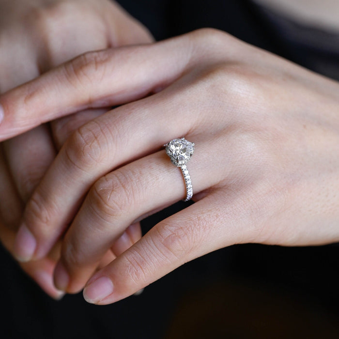 Heart cut moissanite hidden halo engagement ring with pave set white gold band, view 2