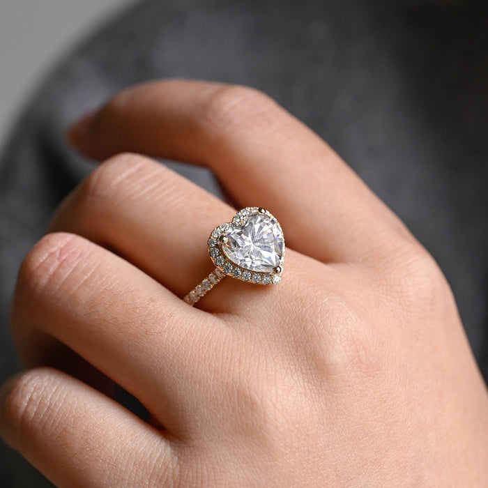Heart cut moissanite classic halo engagement ring with a pave set yellow gold band, view 2