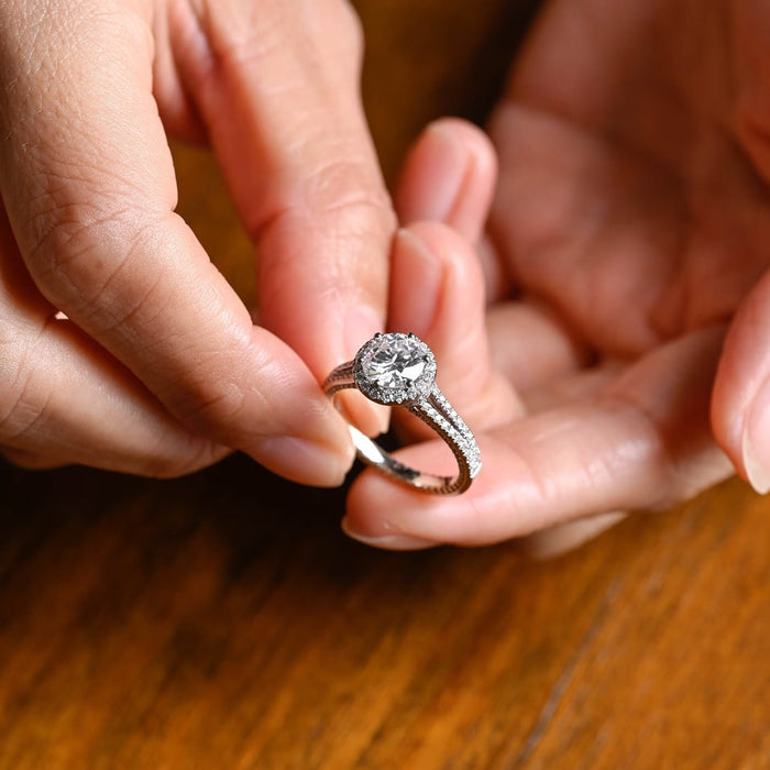 Round moissanite halo engagement ring with a split shank band, both strands pave set with tiny round stones, in white gold, view 2