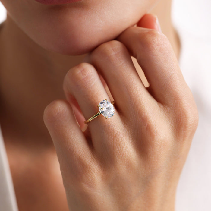 Classic Oval Cut Moissanite Four Claw Solitaire Engagement Ring with Thin Gold Band - view 1