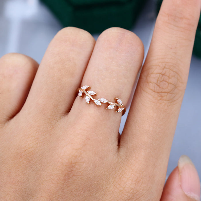 Marquise moissanite twig leaf wedding band, worn on the finger in rose gold
