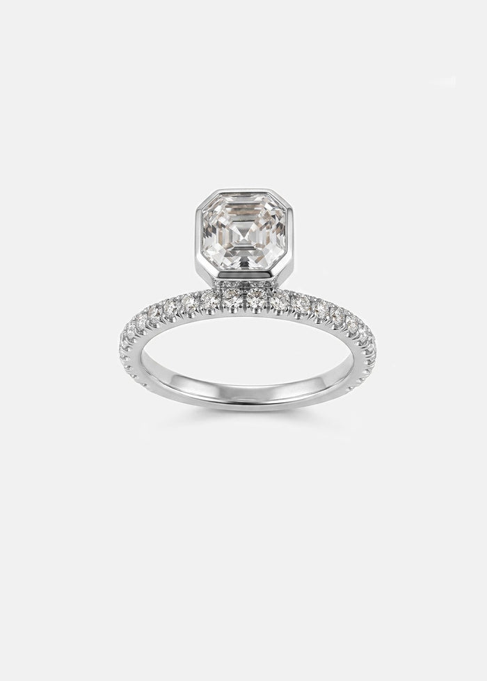 Asscher cut moissanite bezel set engagement ring on a full pave eternity band in yellow gold, view 2