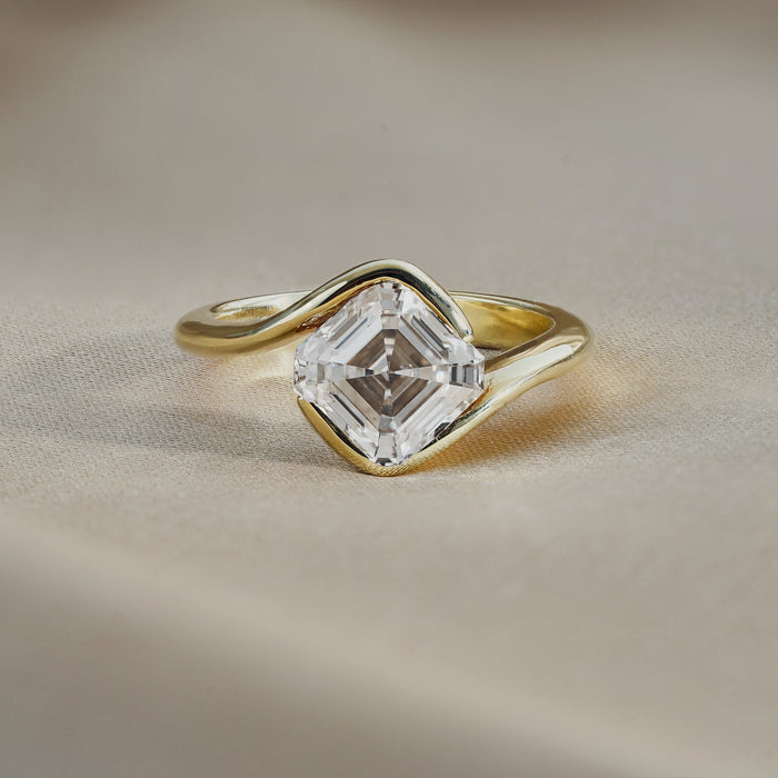 East west asscher cut moissanite swirl bypass solitaire engagement ring in yellow gold, view 2