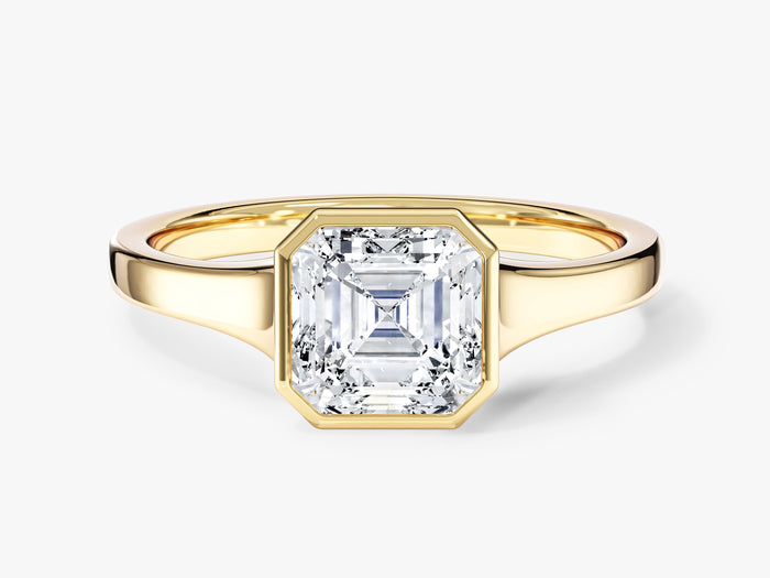 Asscher cut moissanite bezel solitaire engagement ring with tapered flat band in 14K yellow gold, front view