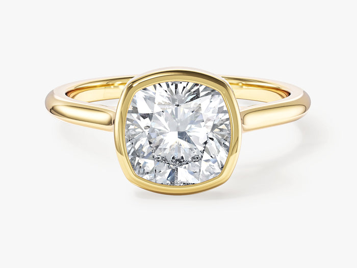 Cushion cut moissanite bezel solitaire engagement ring in yellow gold, front view