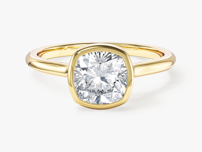 Bezel set cushion moissanite minimalist engagement ring in yellow gold, front view