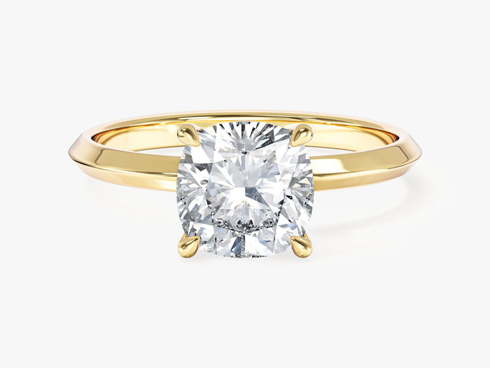 Cushion lab grown diamond knife edge solitaire engagement ring in yellow gold, front view of the talon claws