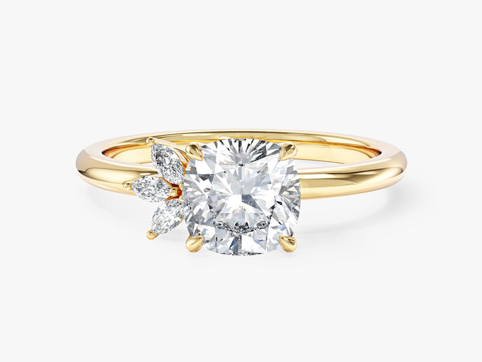 Cushion lab grown diamond engagement ring with a three marquise cluster on one side in yellow gold, front view