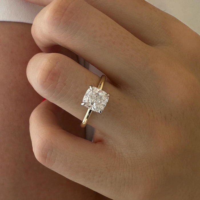 Cushion cut moissanite two tone solitaire engagement ring in white and yellow gold