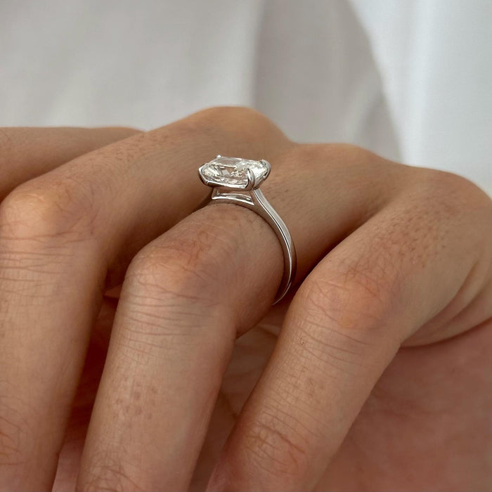 East west elongated cushion moissanite solitaire engagement ring in white gold, view 2